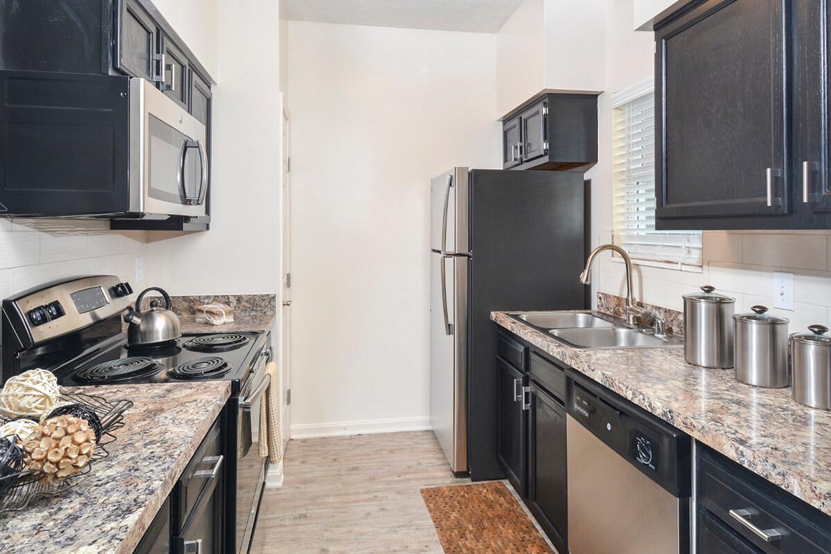 a modern kitchen with stainless steel appliances
