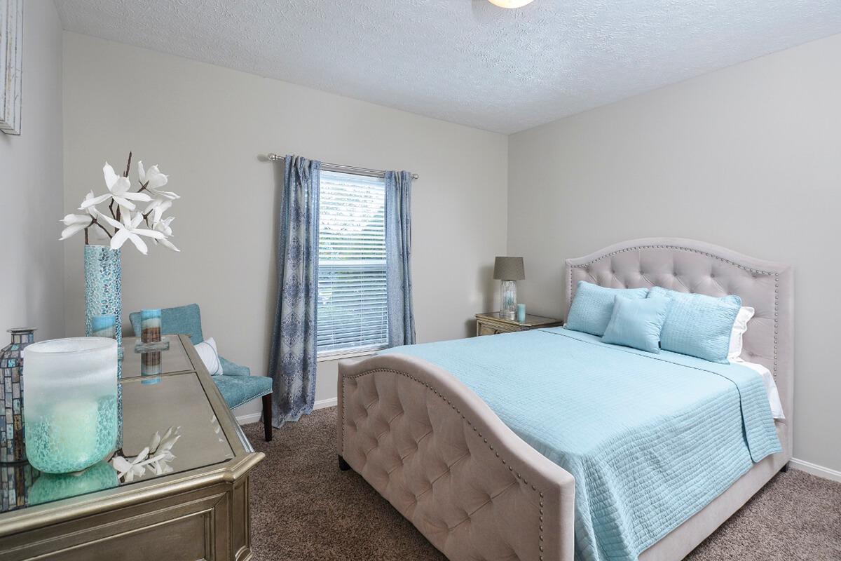 a bedroom with a bed in a hotel room