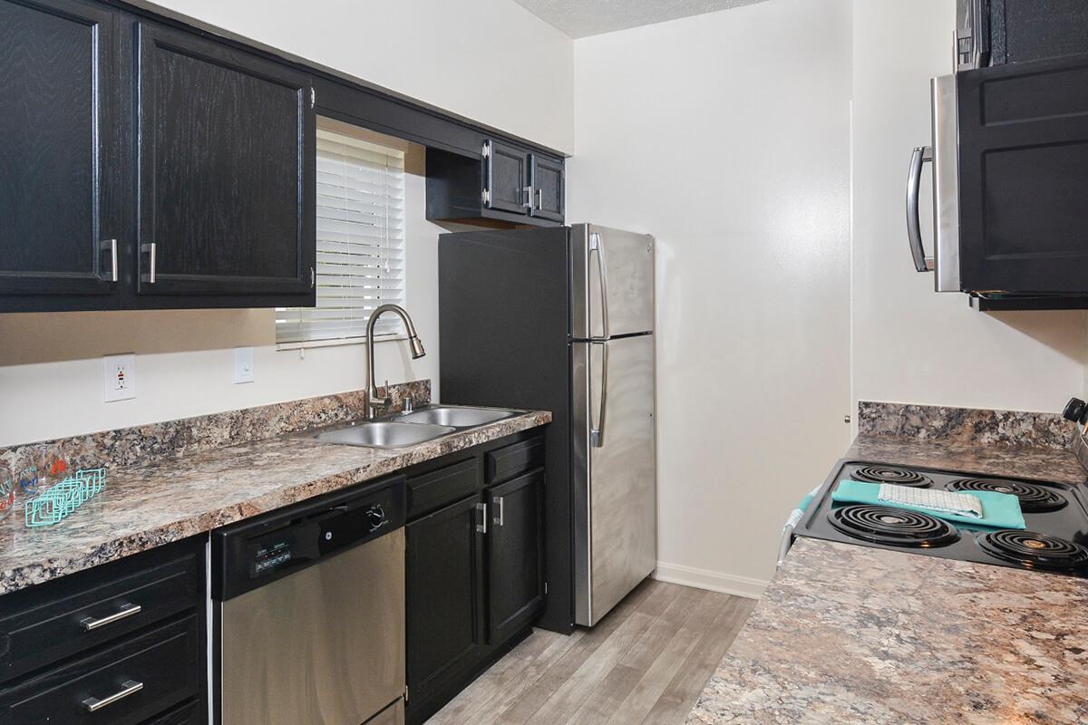 a modern kitchen with stainless steel appliances