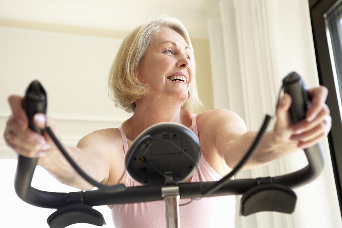 Senior Woman On Exercise Bike.jpg