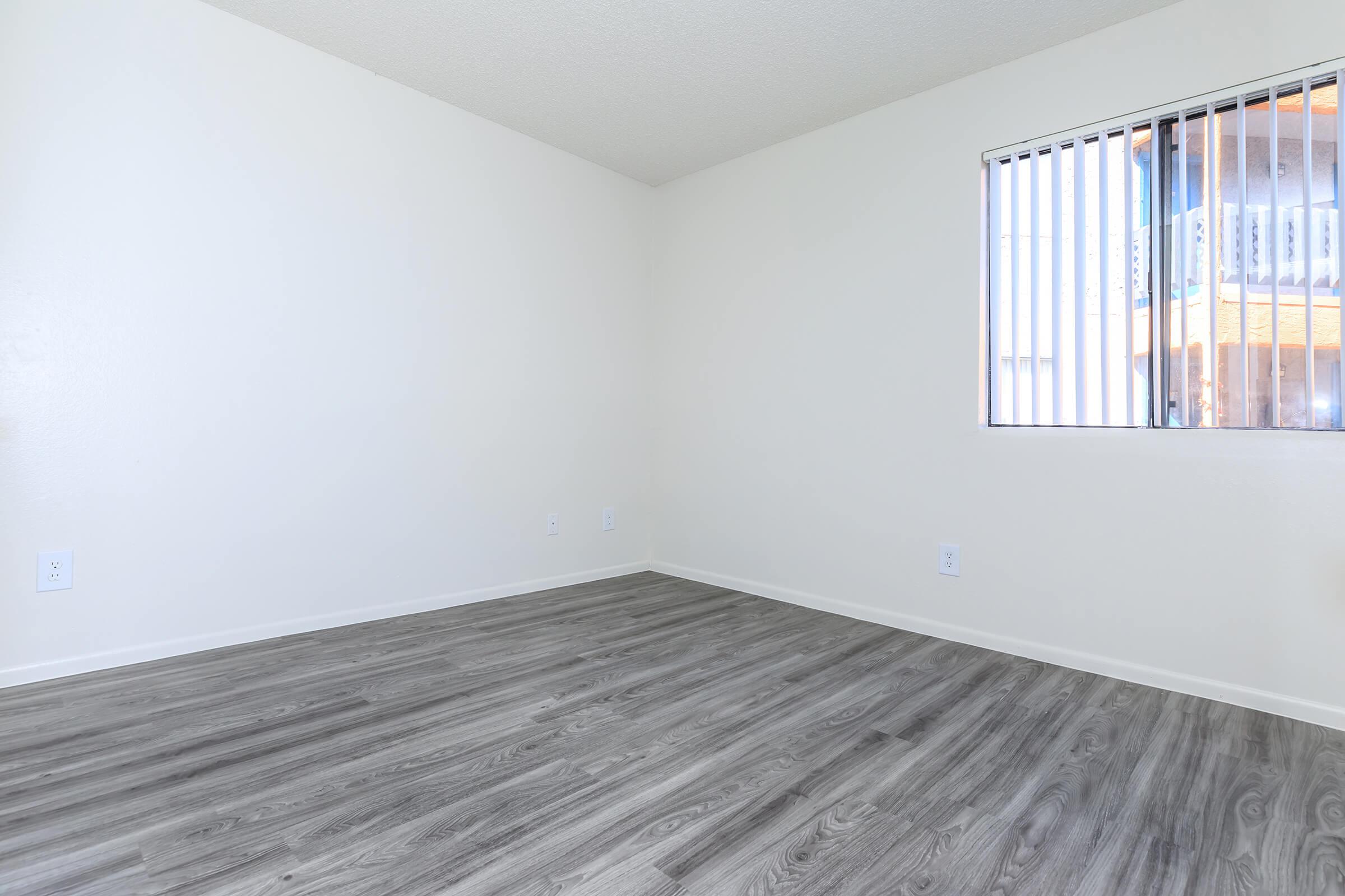 a bedroom with a large window