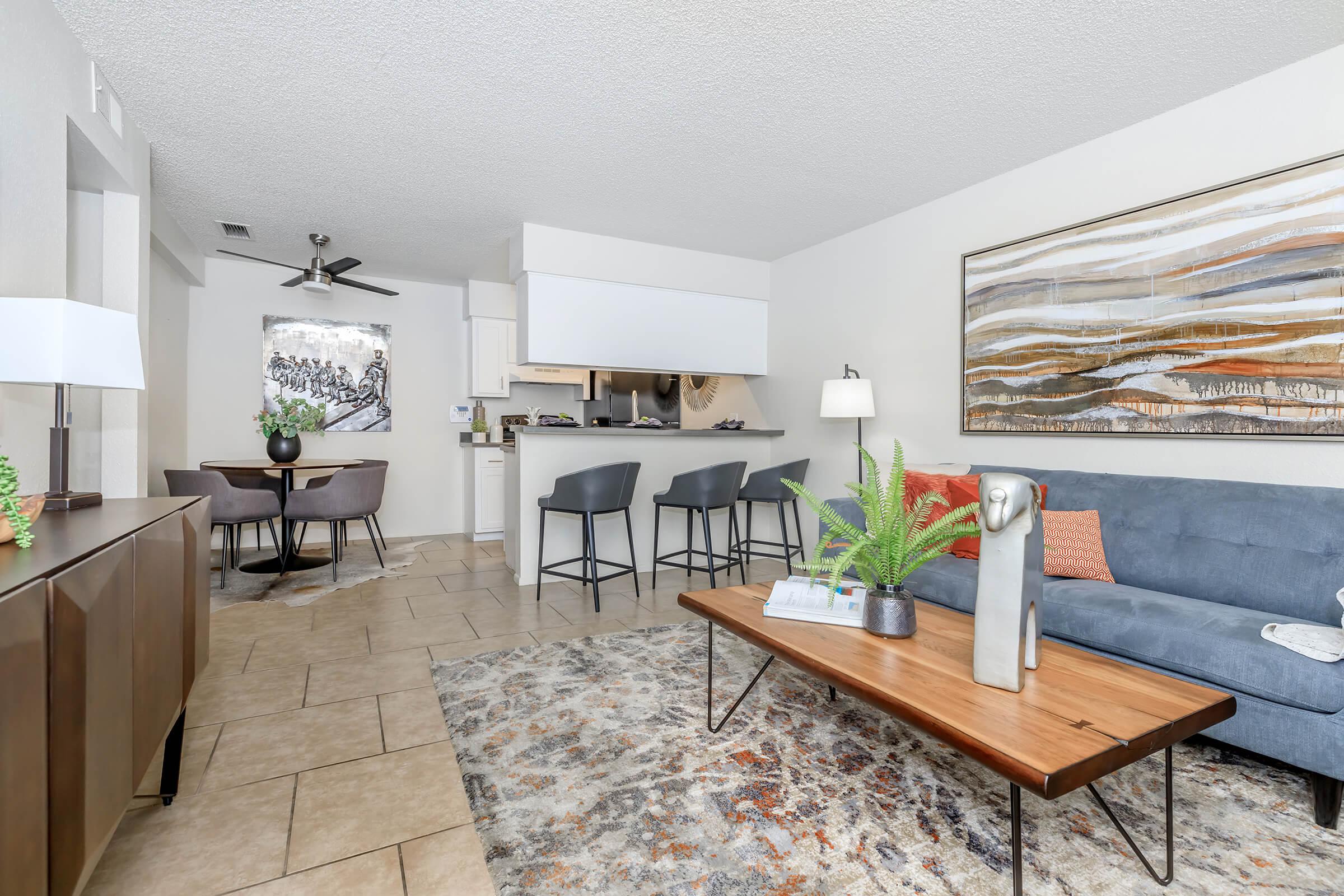 a living room filled with furniture and a table