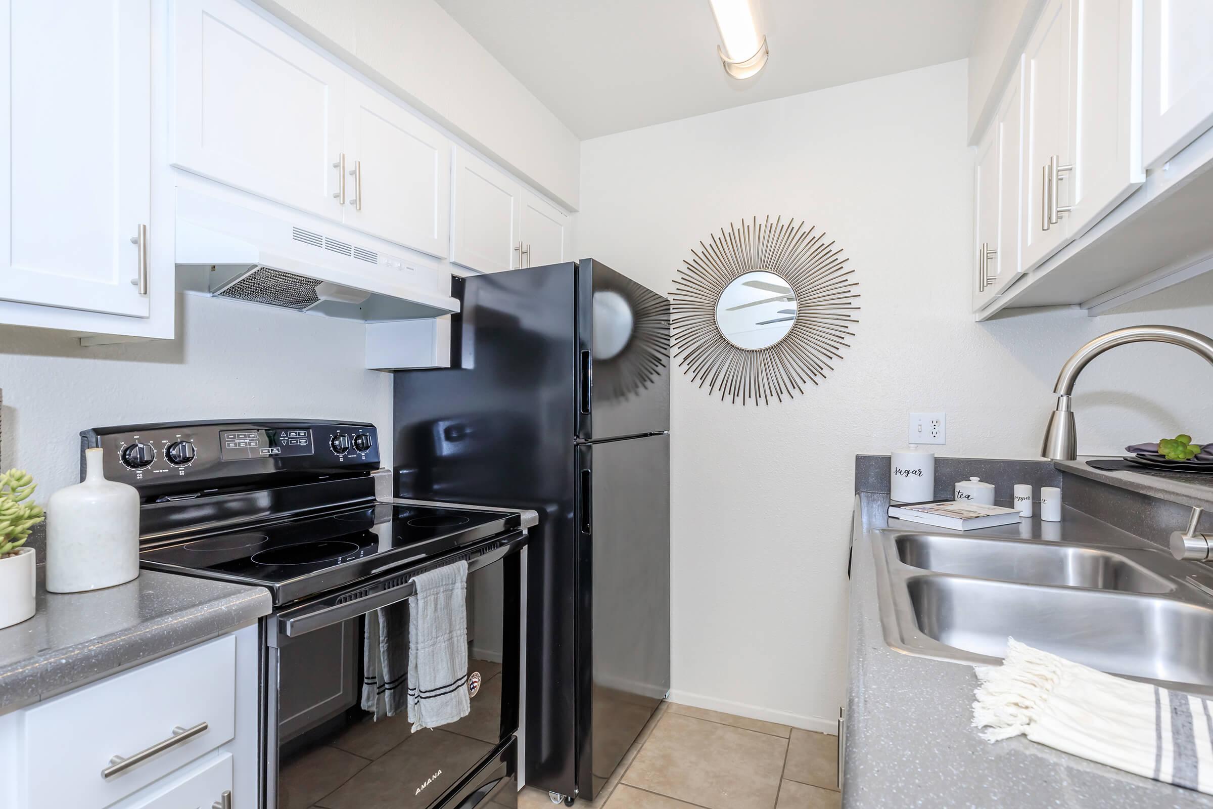 a kitchen with a stove and a sink