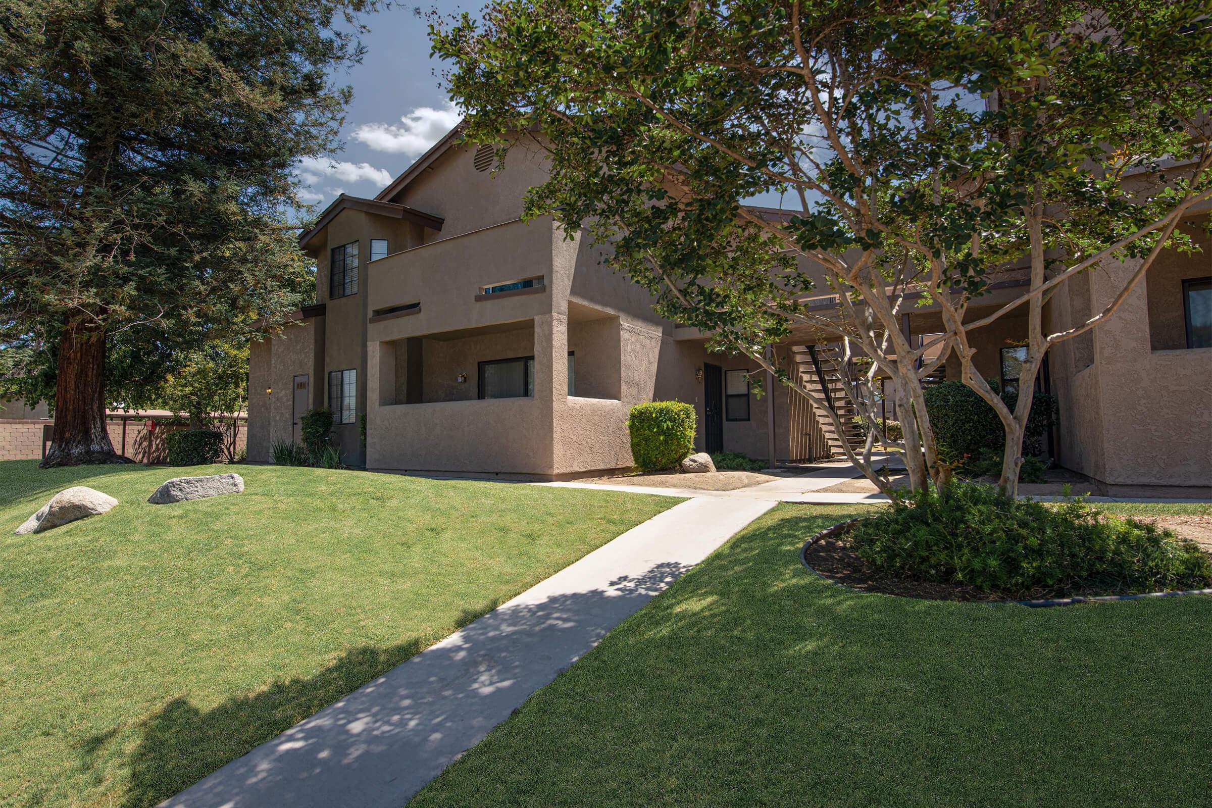 A community building with green grass and trees