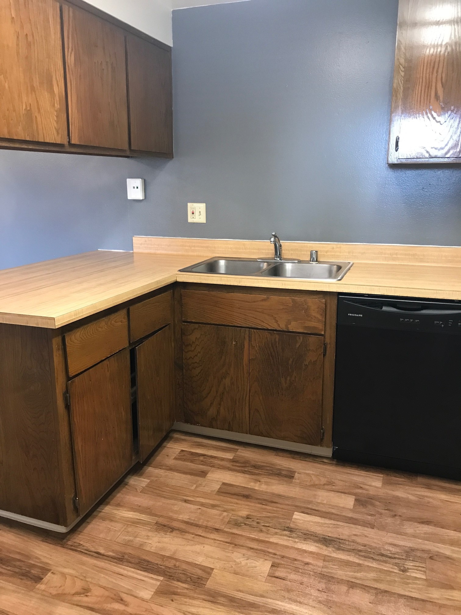 Vacant kitchen with stainless steel sink