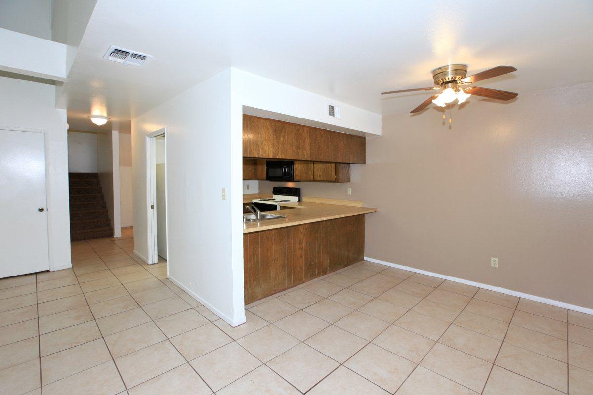 Dining room and kitchen with tile flooring