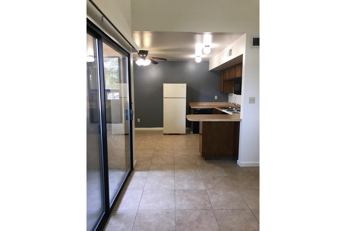 Glass sliding doors with the kitchen in the background