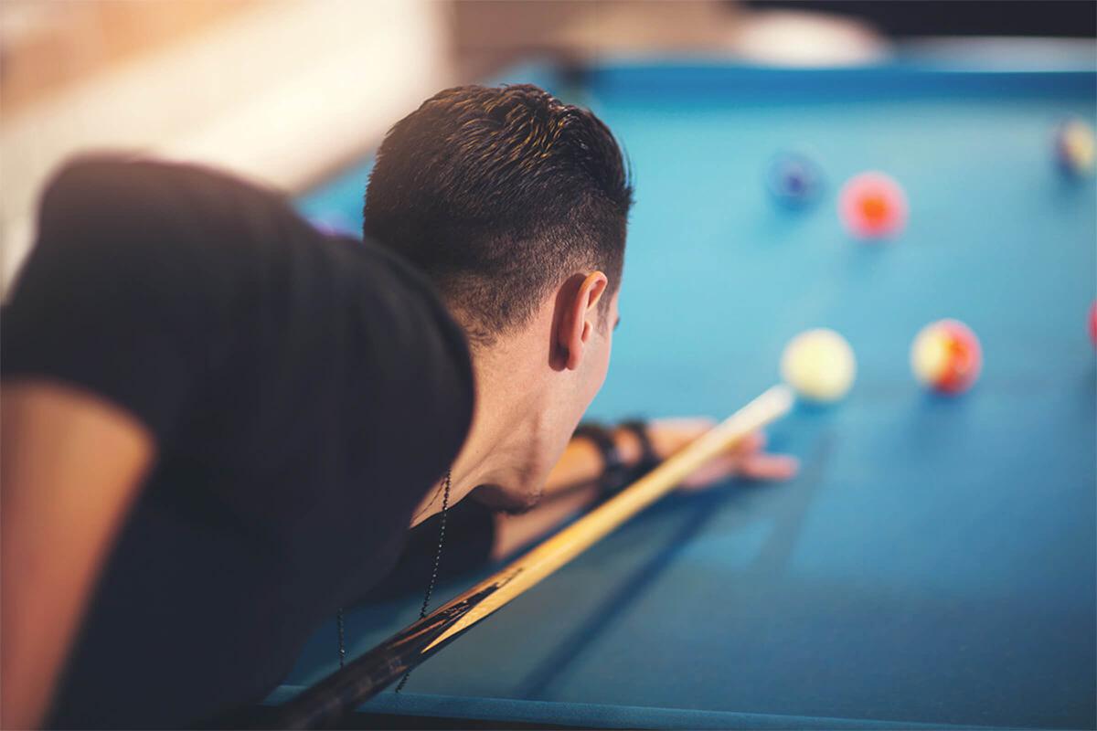 man playing pool iStock-636188860.jpg