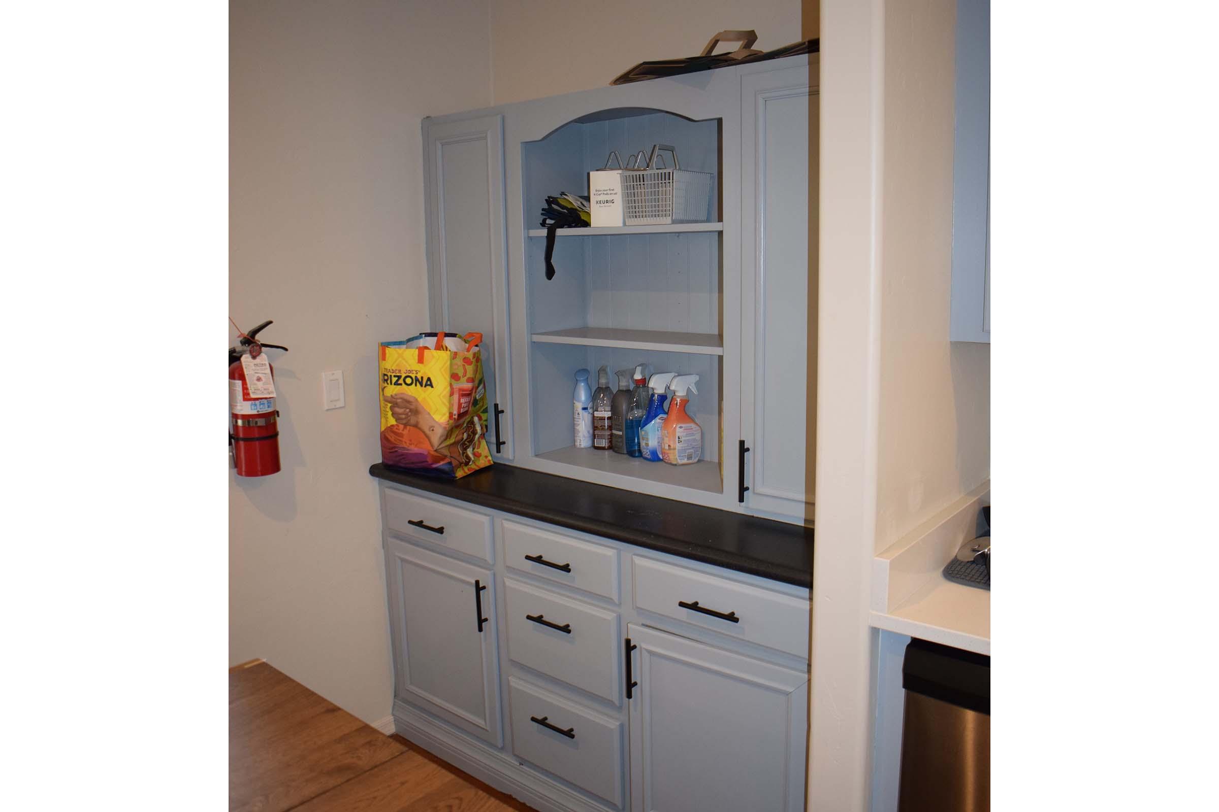 a kitchen with a sink and a refrigerator