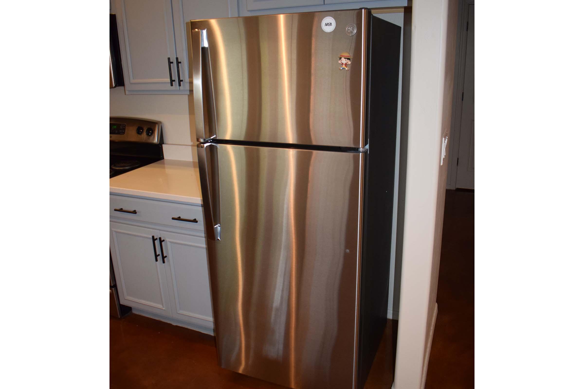 a stainless steel refrigerator in a kitchen