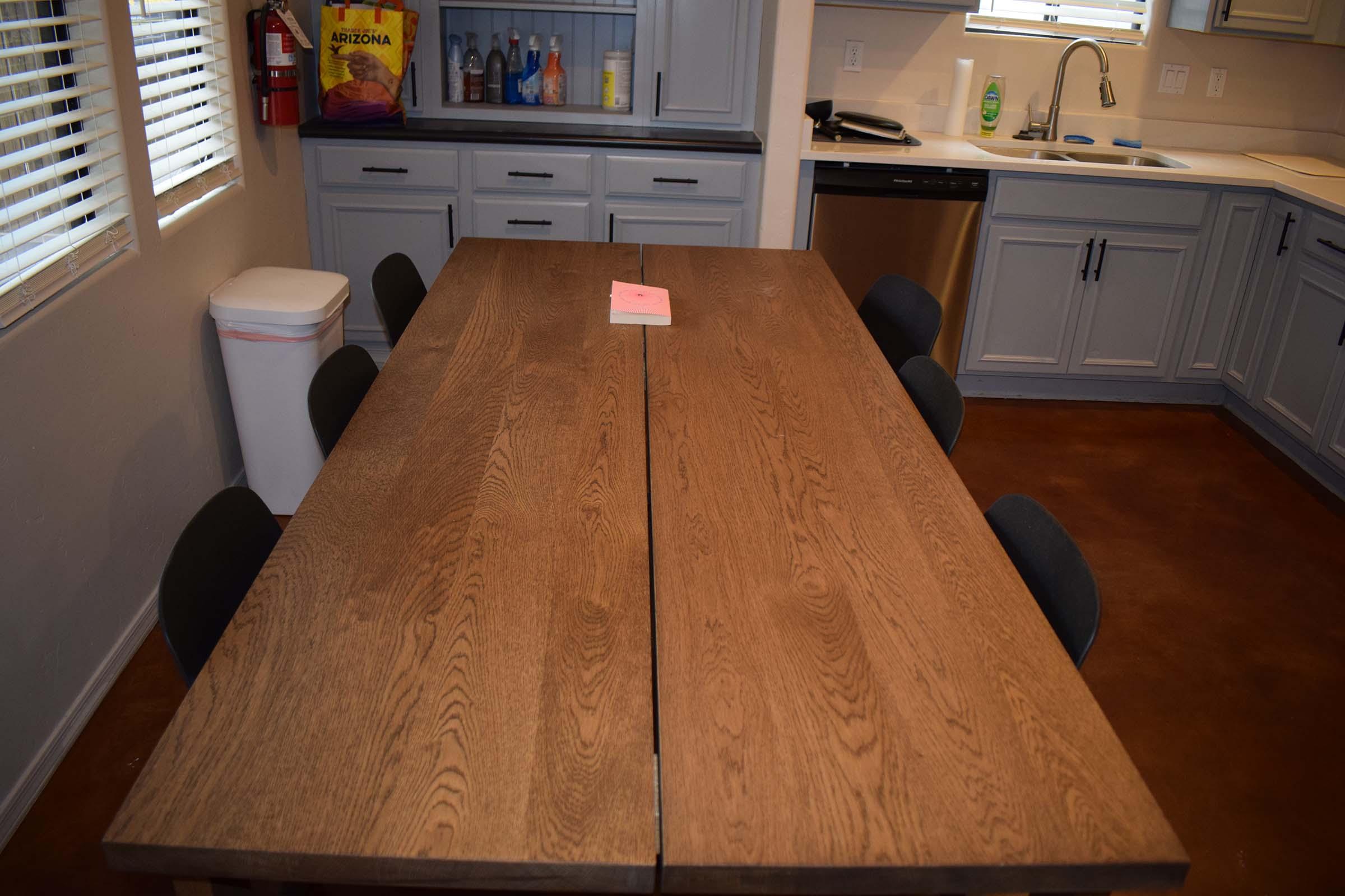 a kitchen with a table in a room