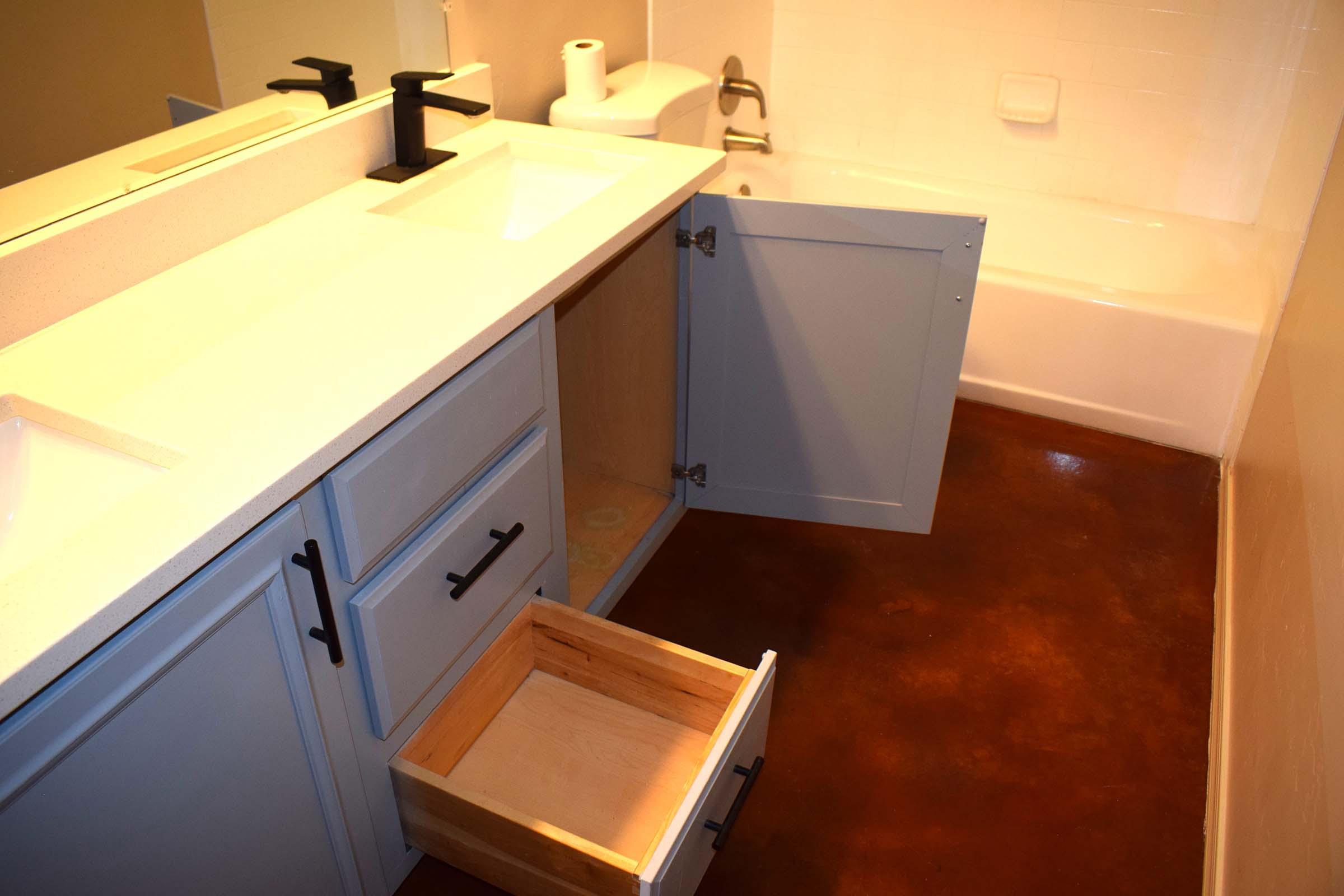 a kitchen with a sink and a mirror