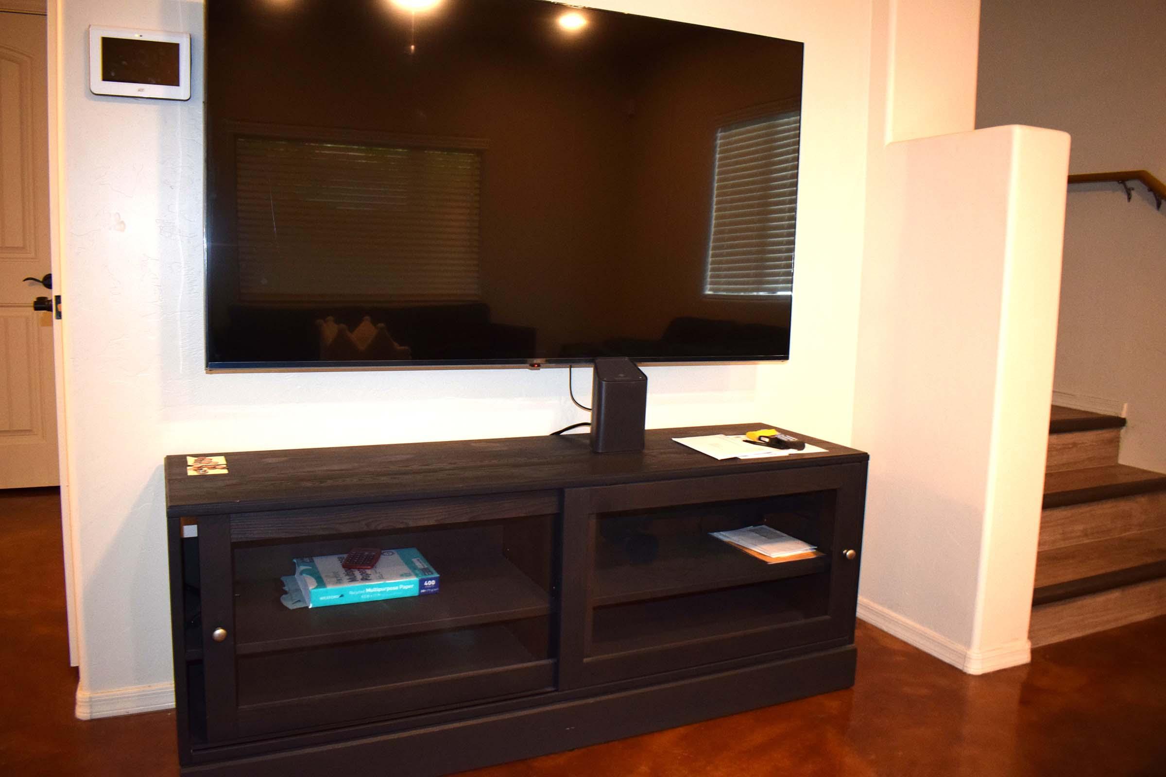 a flat screen tv sitting in a living room