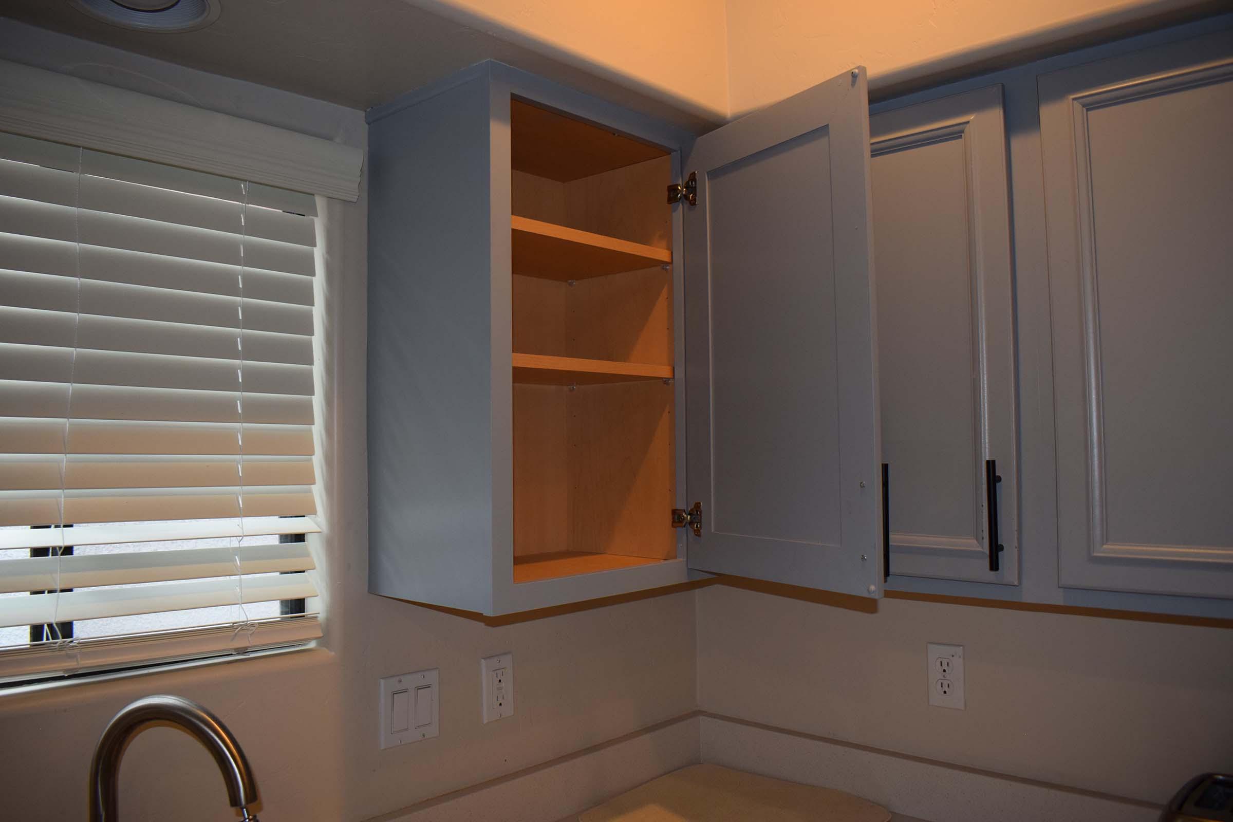 a kitchen with a sink and a microwave