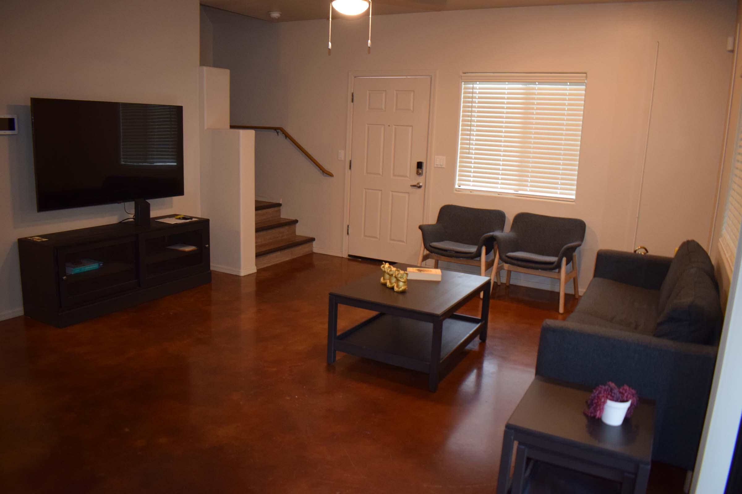 a living room with a wooden floor