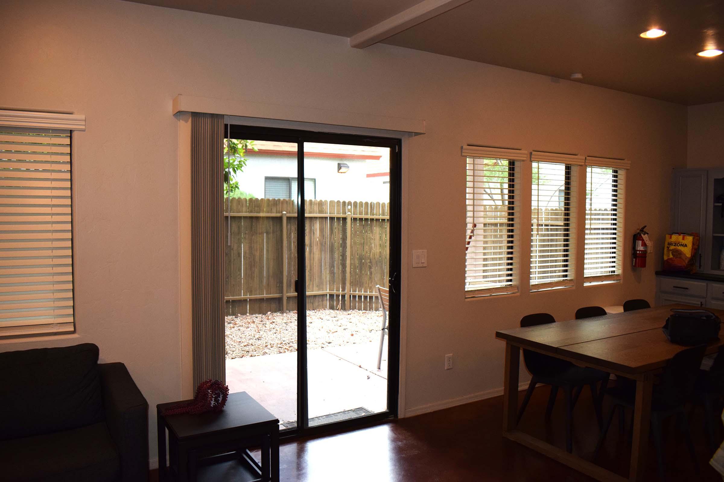 a living room filled with furniture and a large window