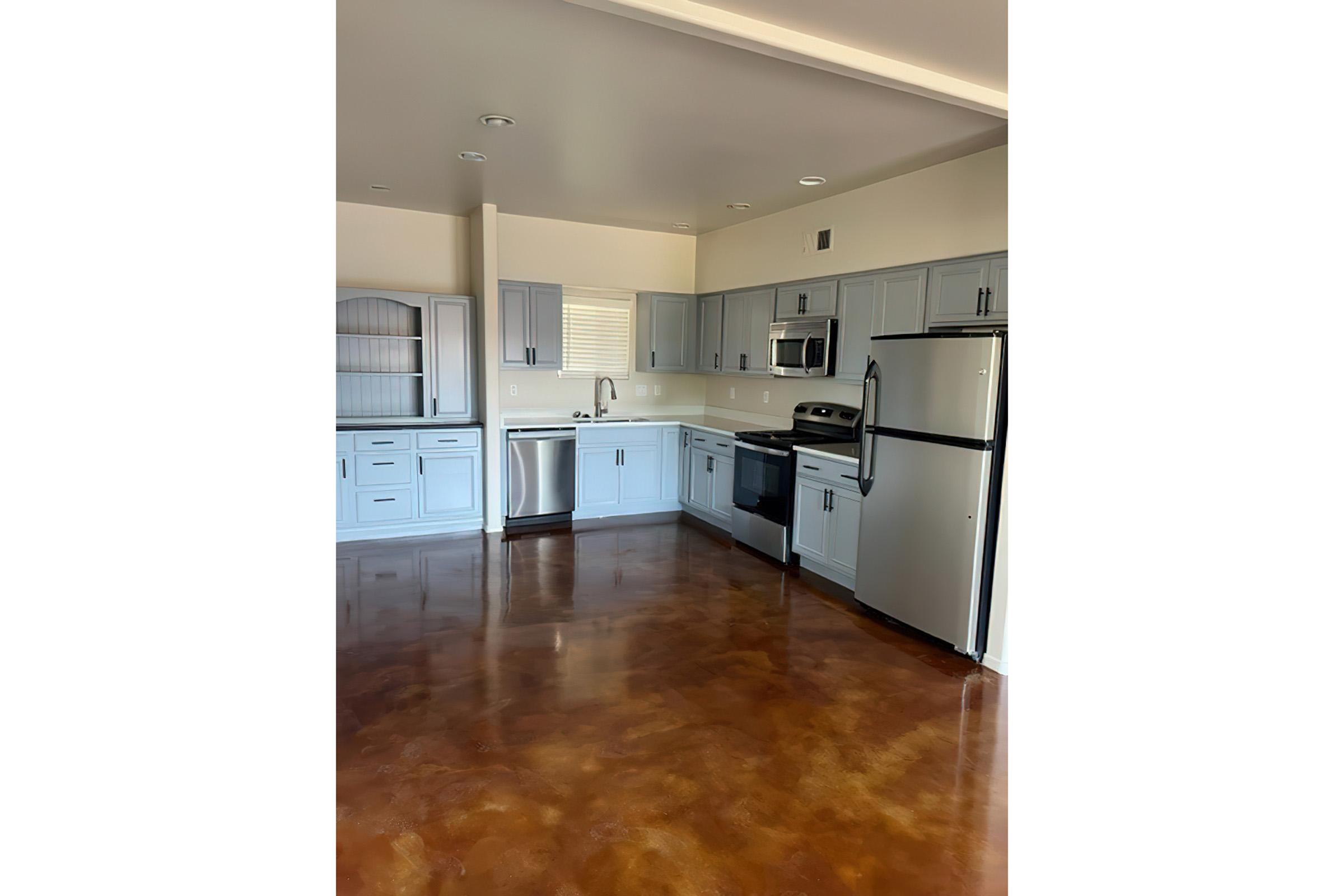 a kitchen with a wood floor