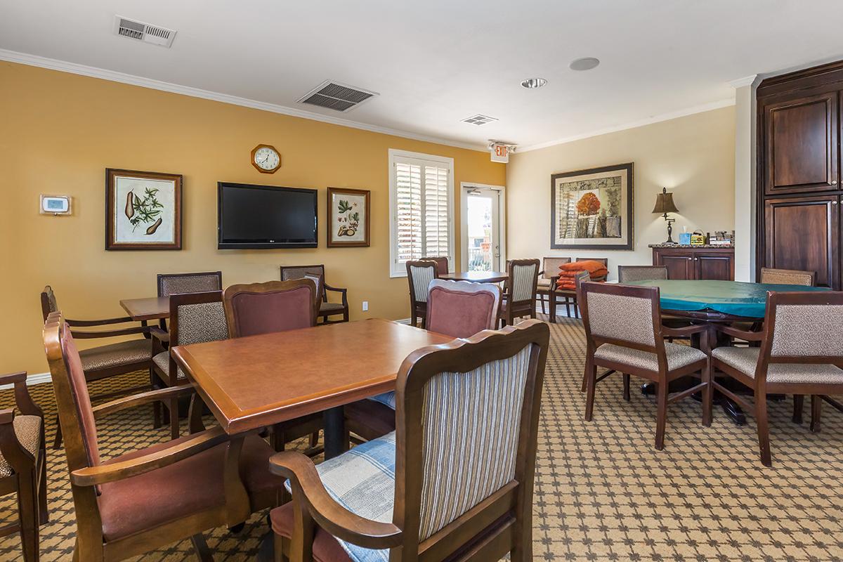 a living room filled with furniture and a table