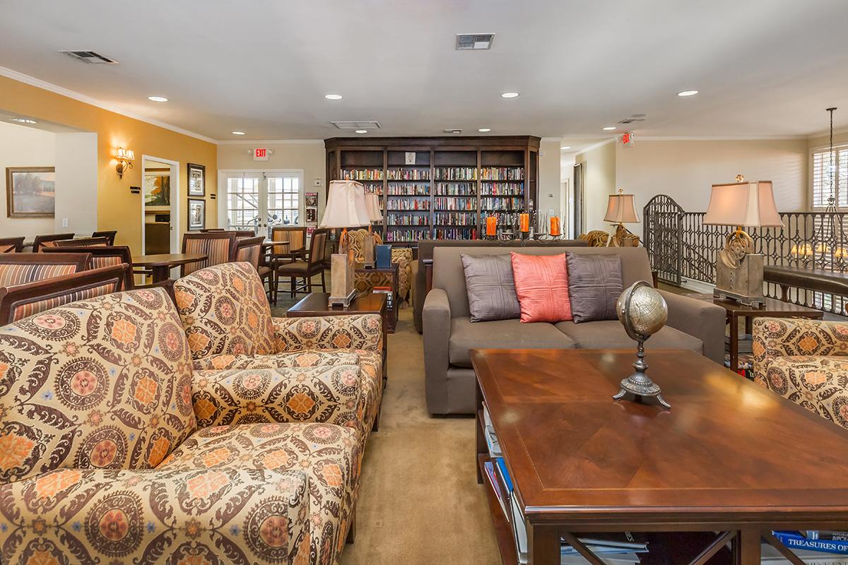 a living room filled with furniture and a fire place