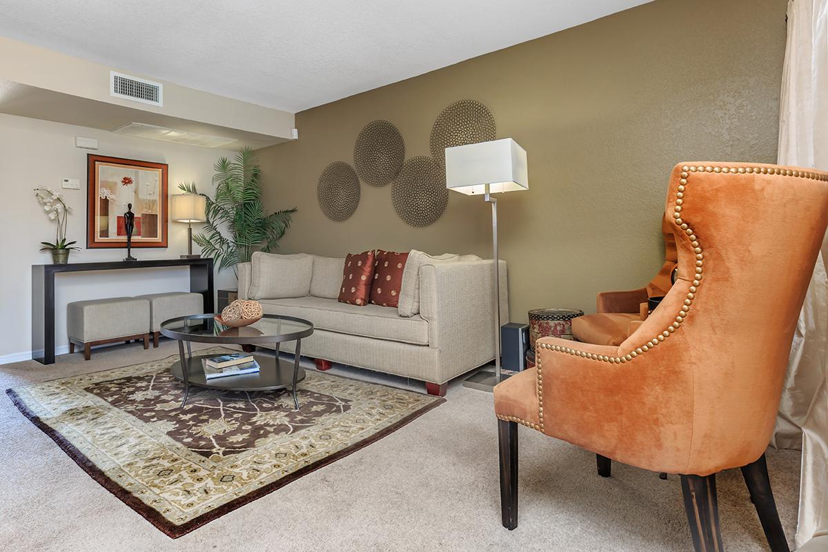 a living room filled with furniture and a fire place