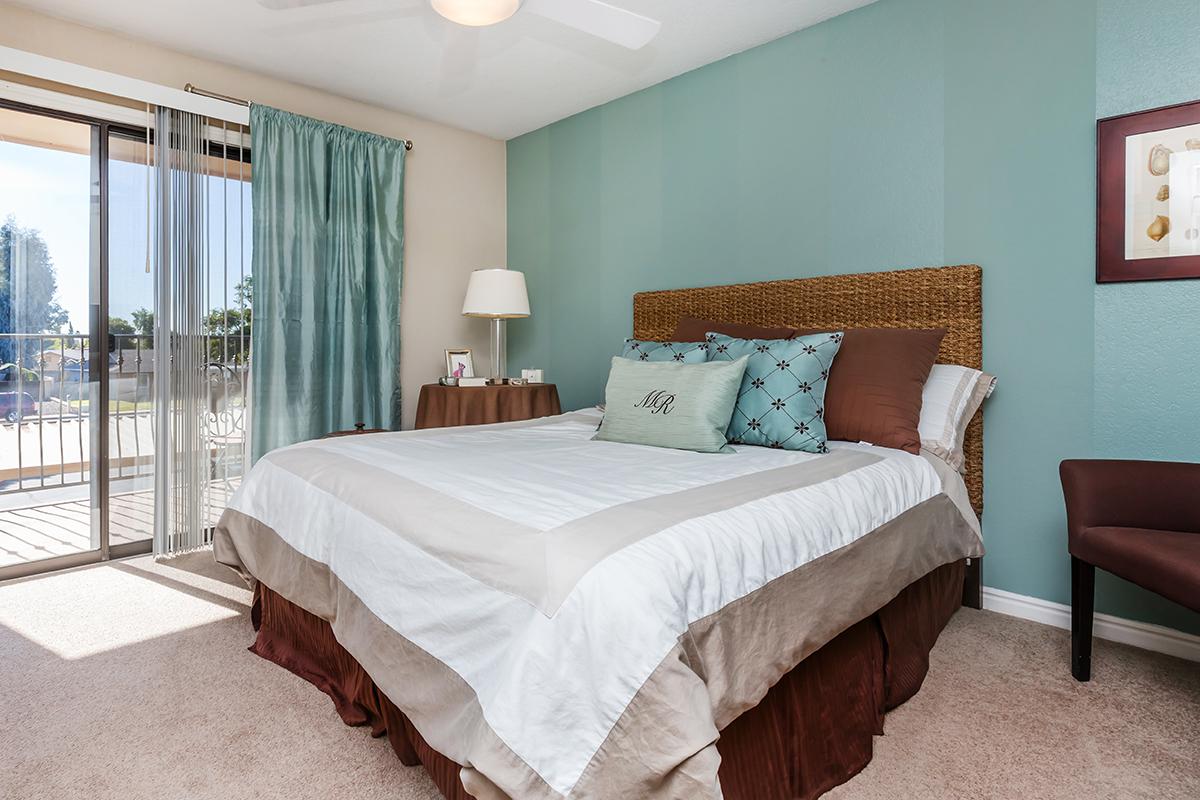 a bedroom with a large bed in a hotel room