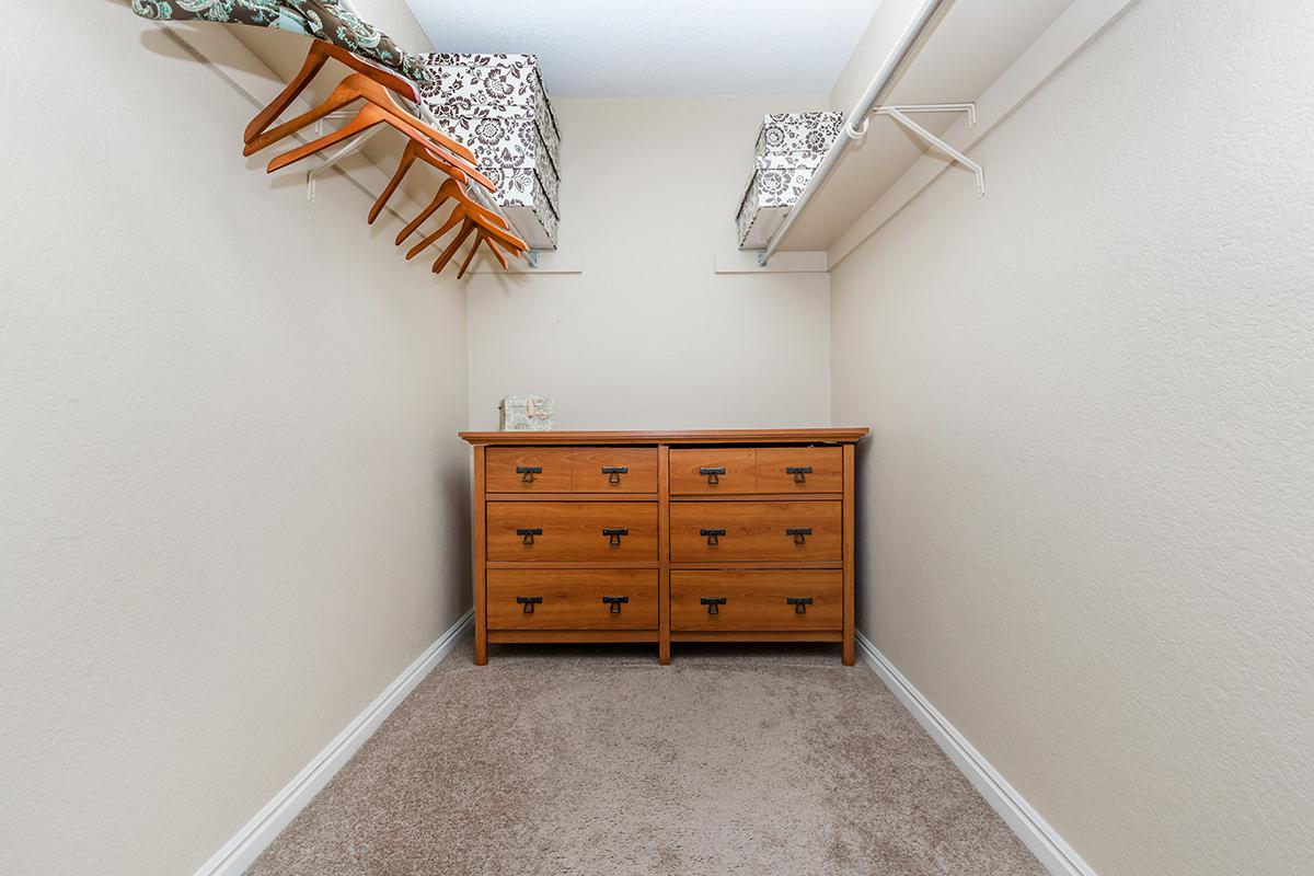 a bedroom with a wooden floor