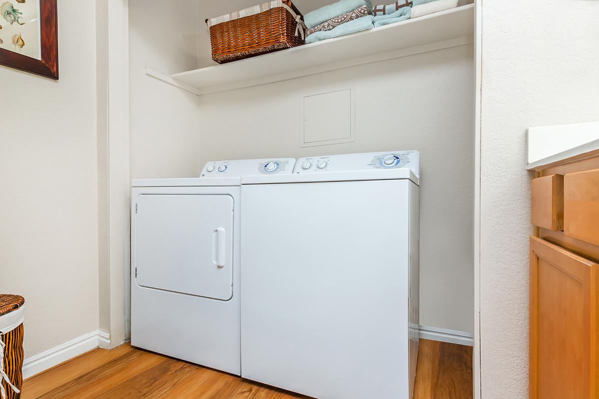 a white refrigerator freezer sitting inside of a kitchen