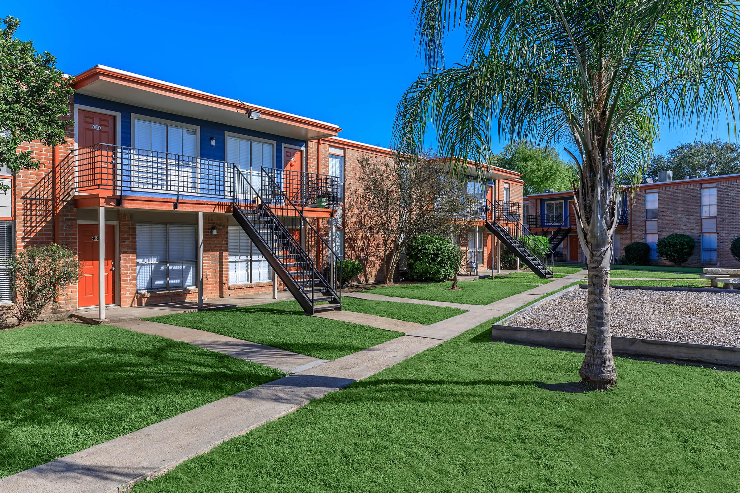 a large lawn in front of a house