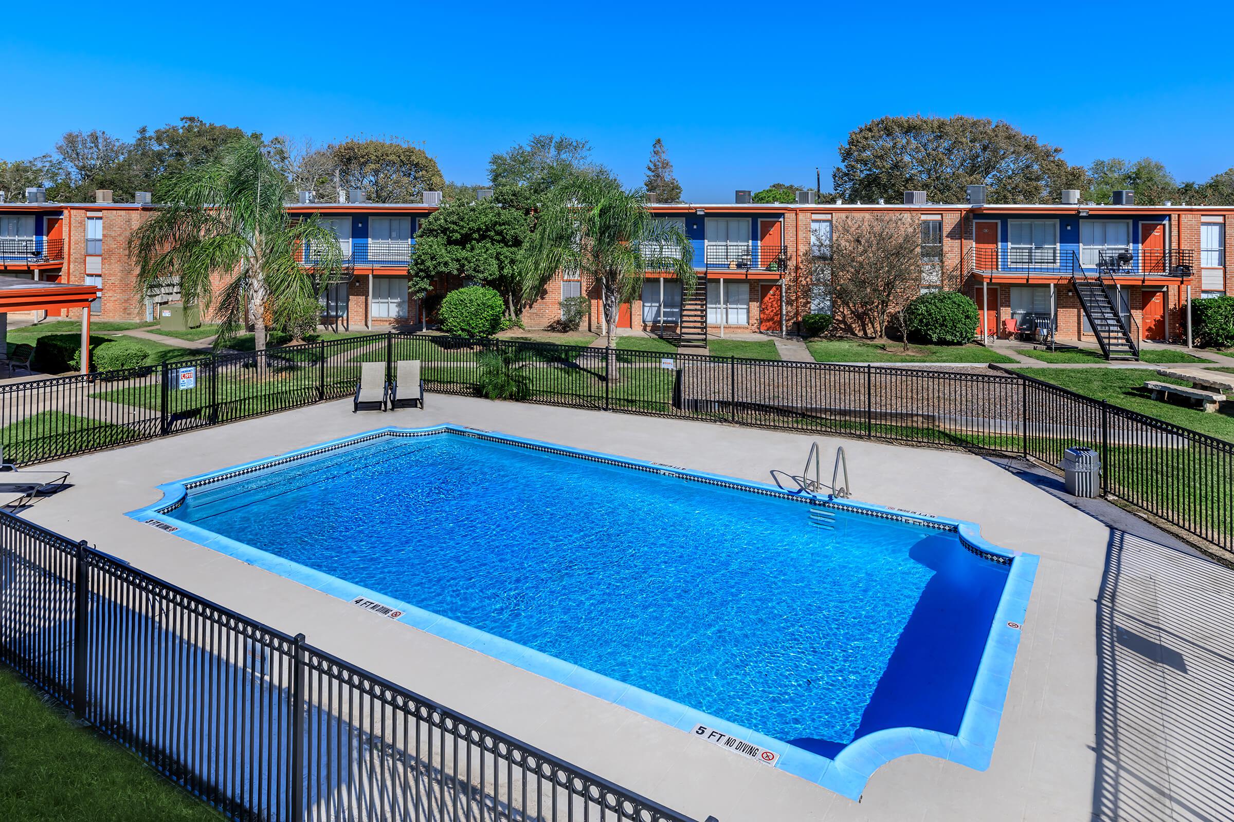 a pool next to a fence