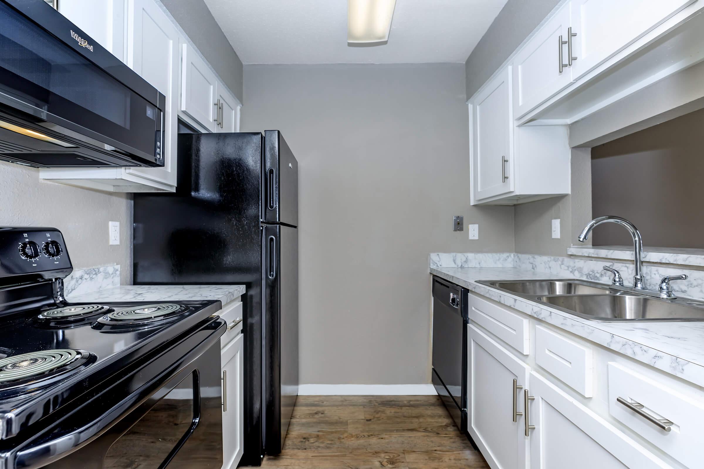 a modern kitchen with stainless steel appliances