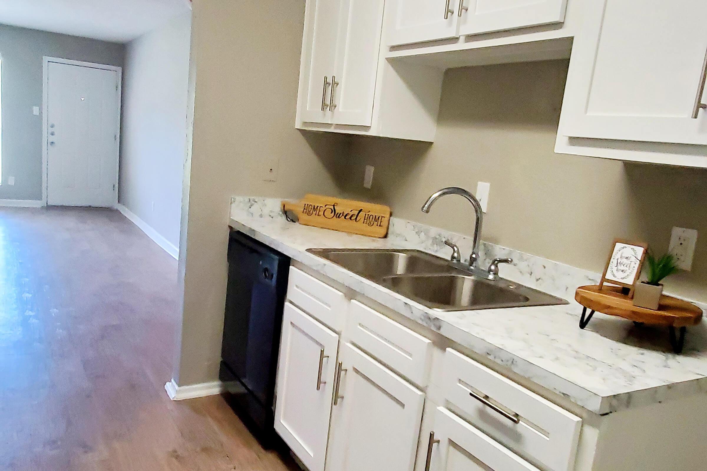 a kitchen with a stove and a sink