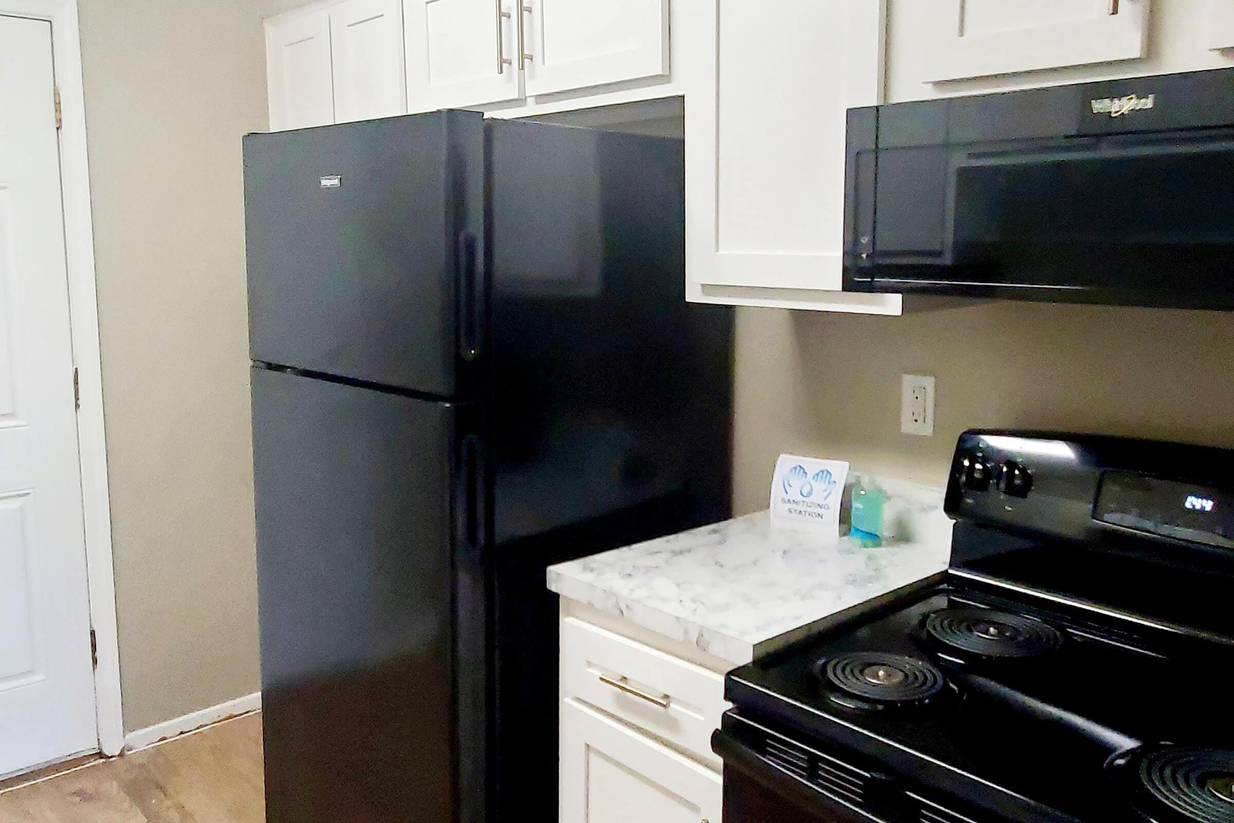 a kitchen with a stove top oven sitting inside of a refrigerator