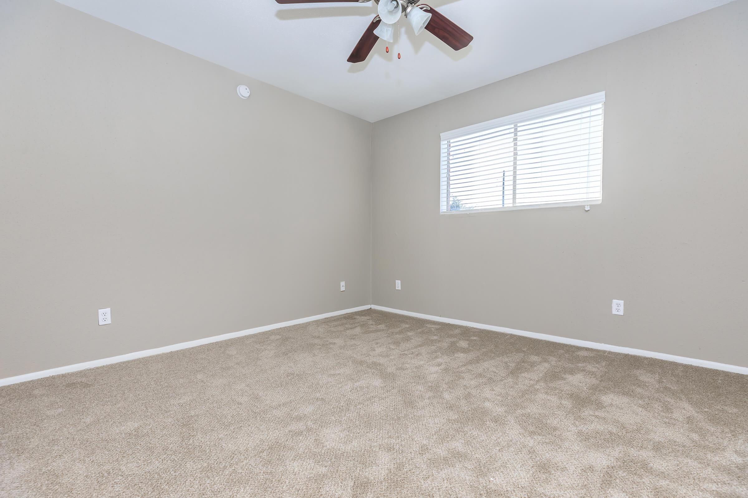 a bedroom with a large window