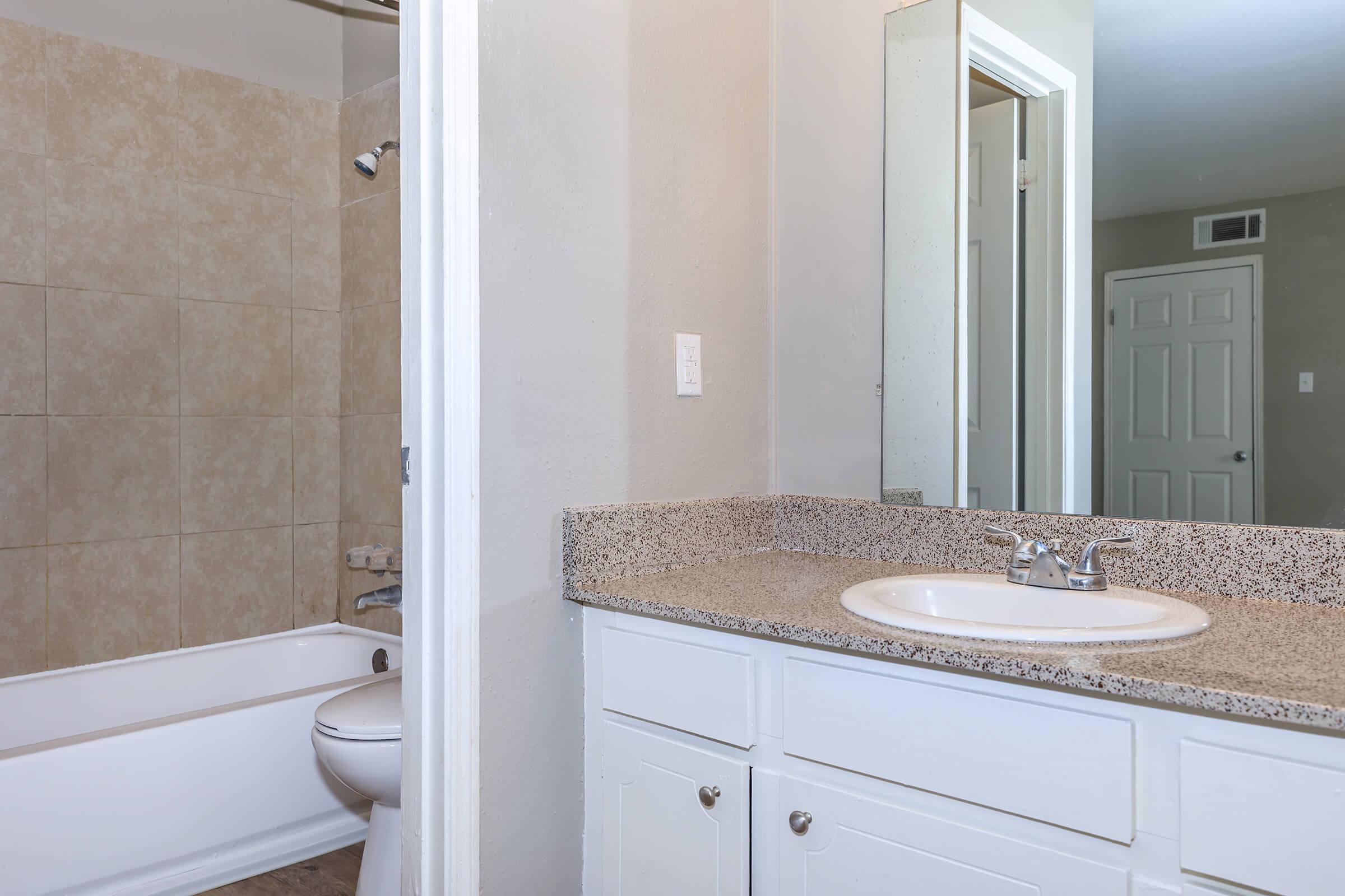 a view of the shower and sink