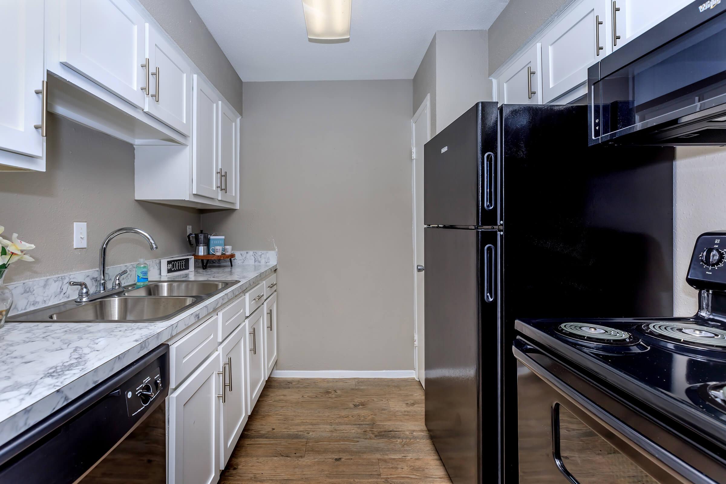 a modern kitchen with stainless steel appliances