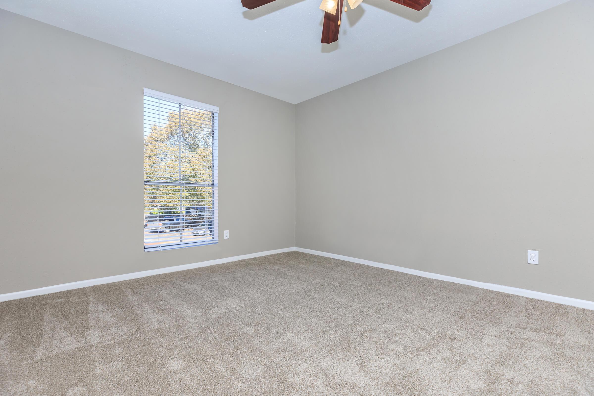 a bedroom with a large window