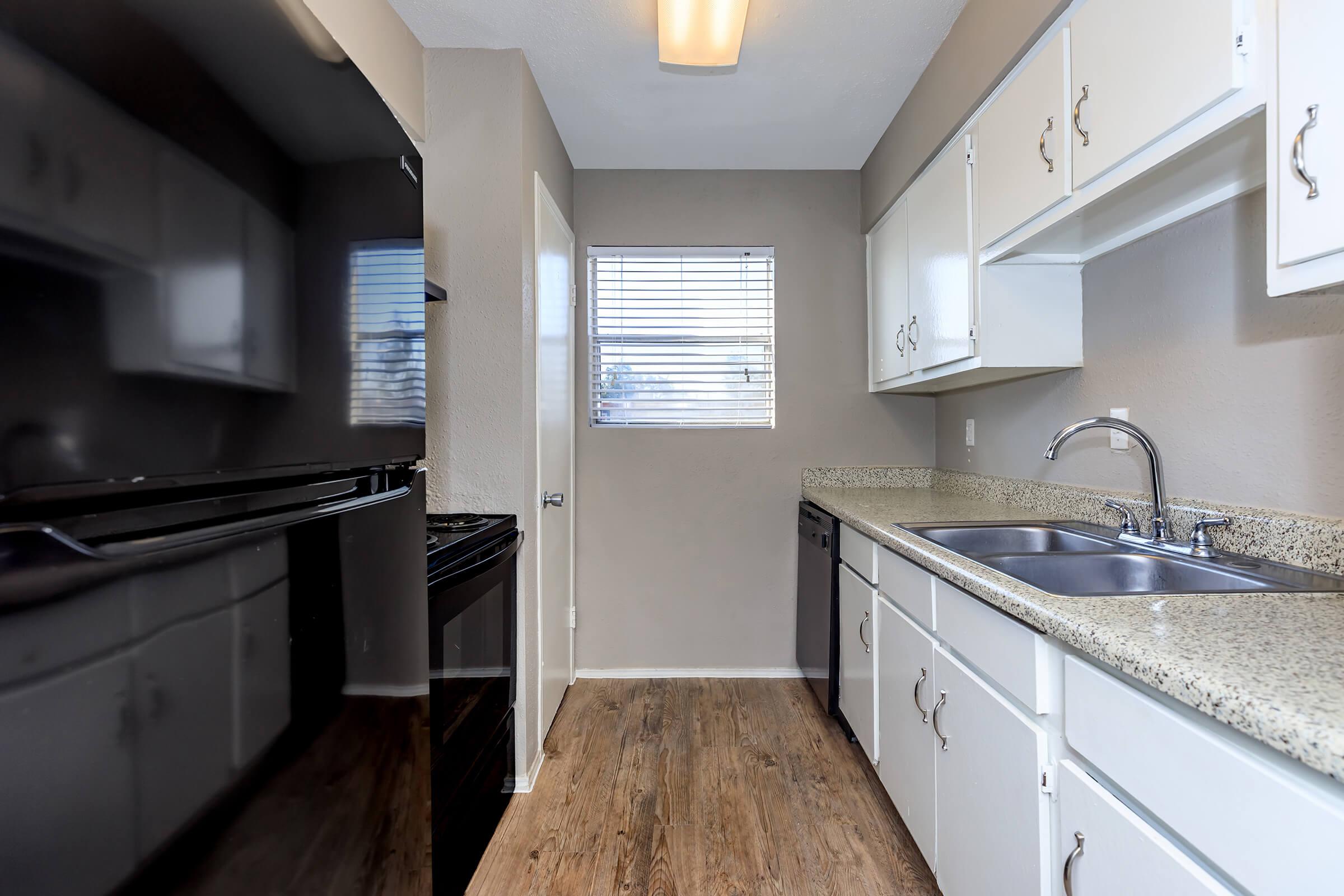 a kitchen with a sink and a window