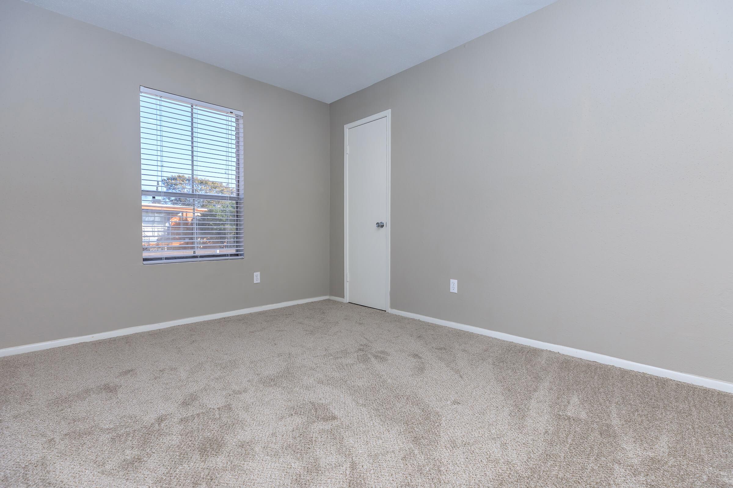 a bedroom with a large window