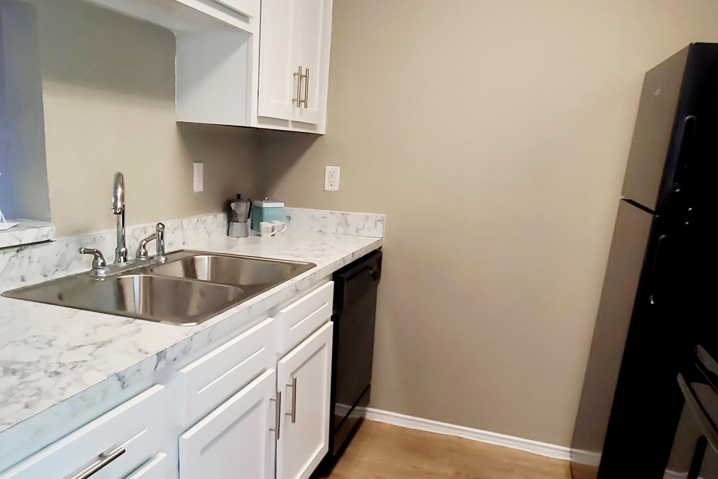 a kitchen with a sink and a microwave