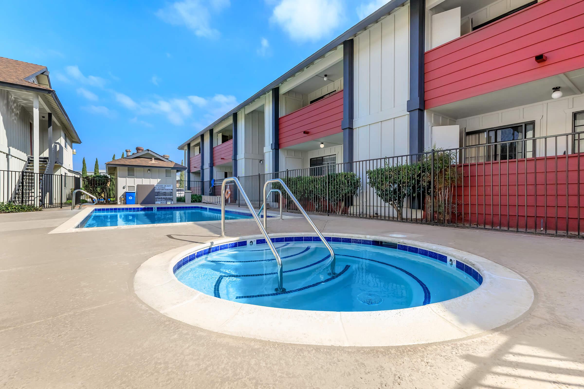 a house with a pool outside of a building