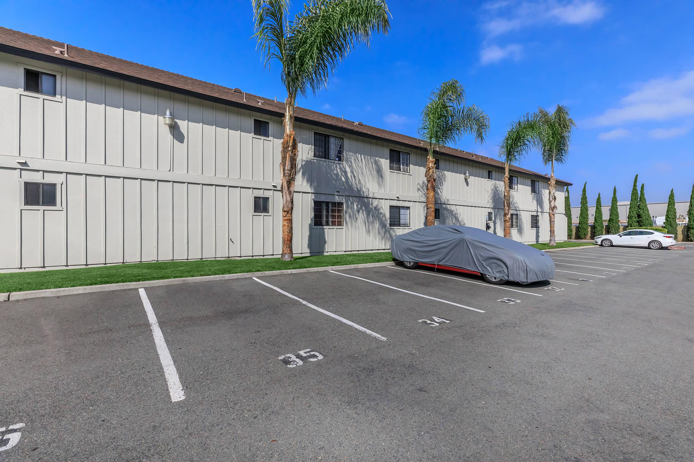 an empty parking lot in front of a building