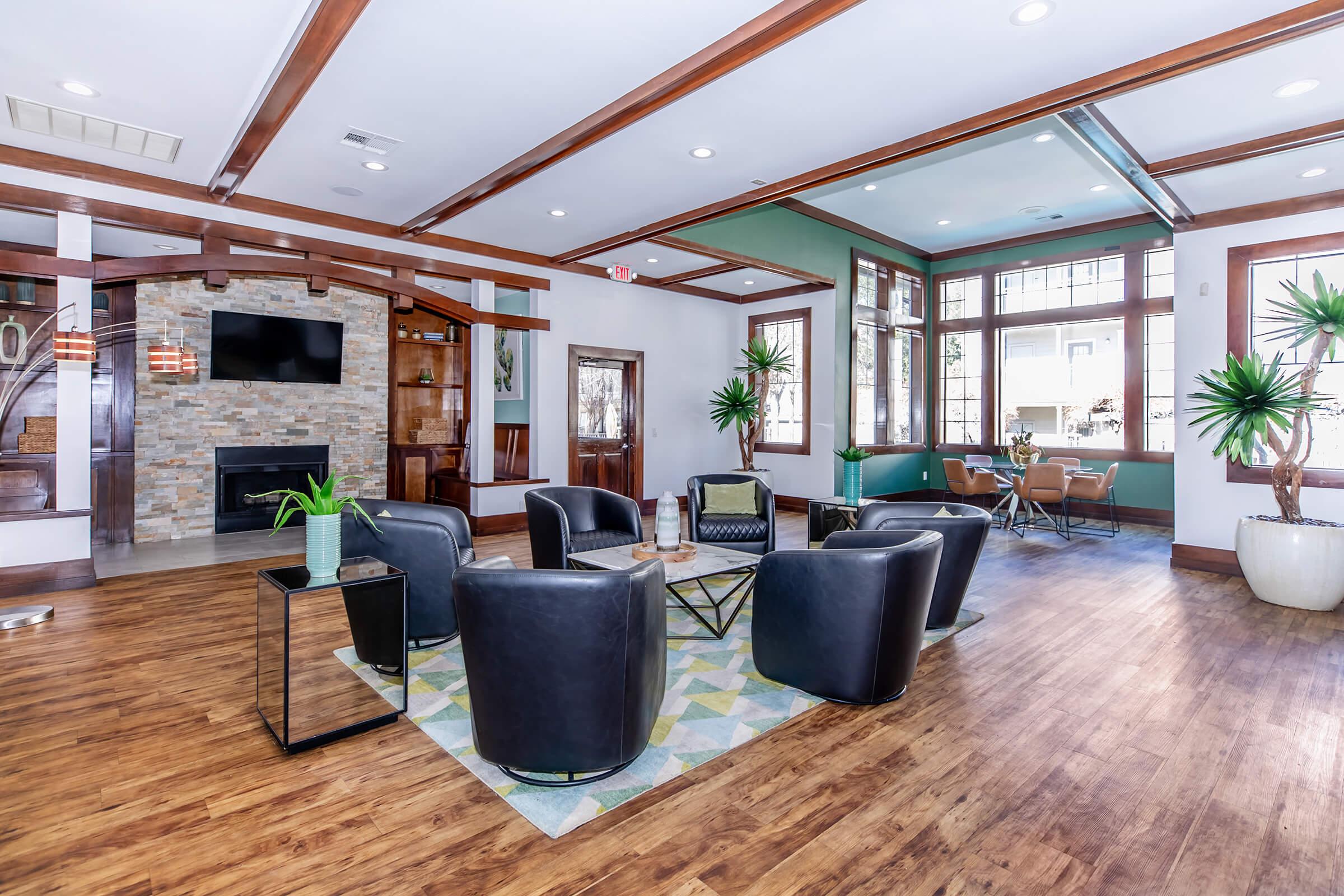 a living room filled with furniture and a large window