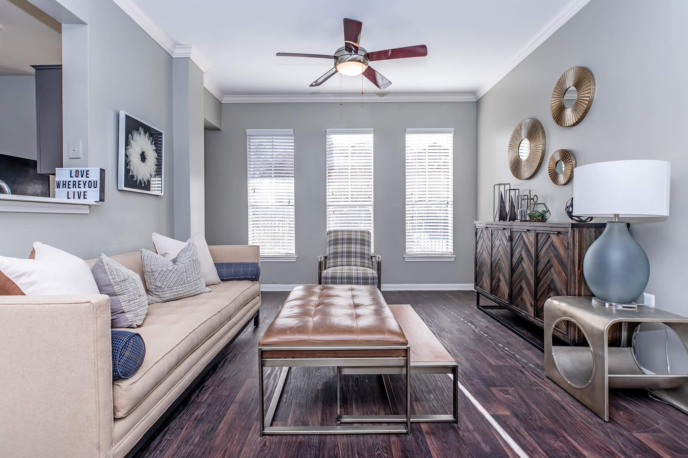 a living room filled with furniture and a fire place