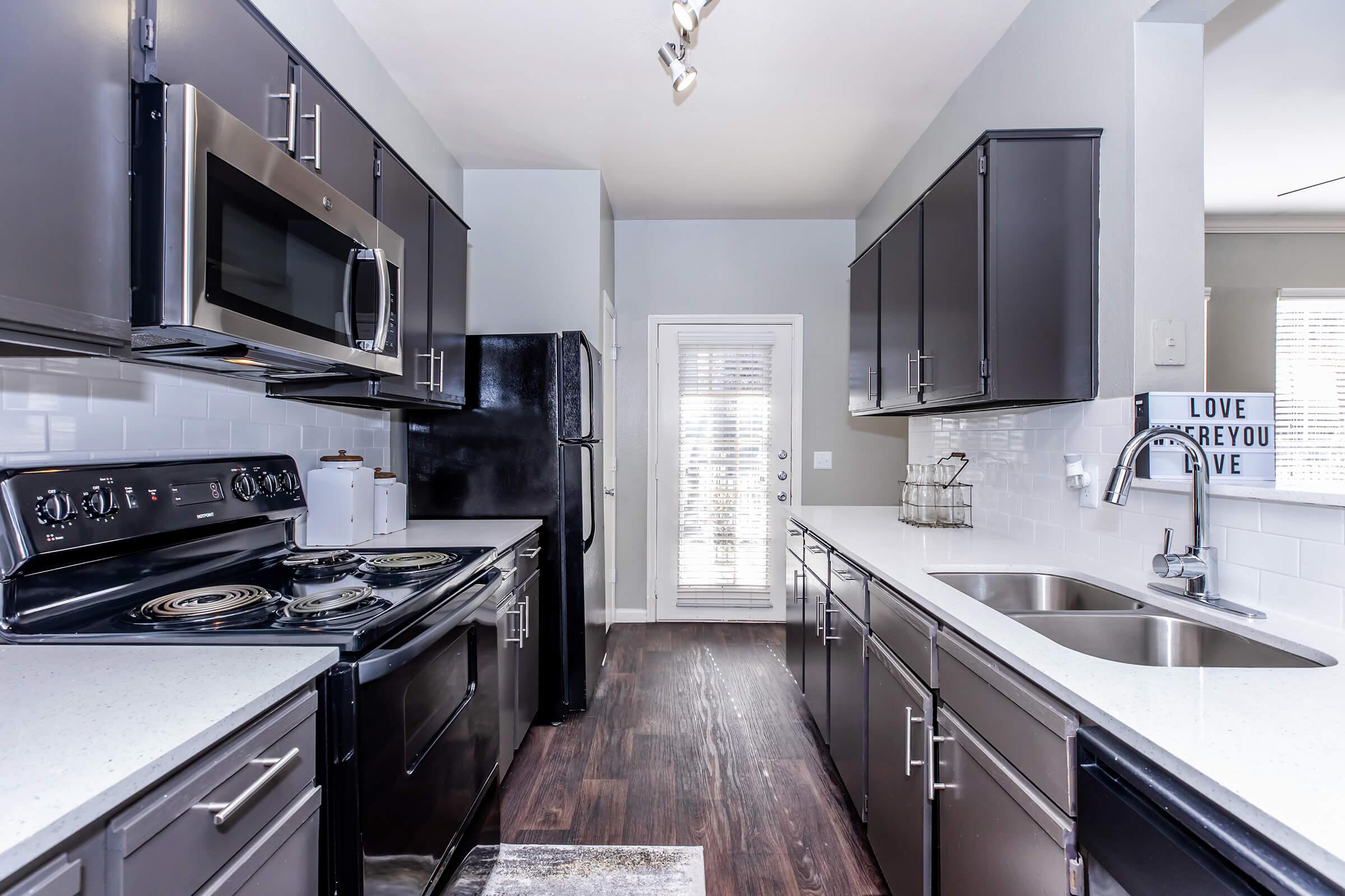 a modern kitchen with stainless steel appliances