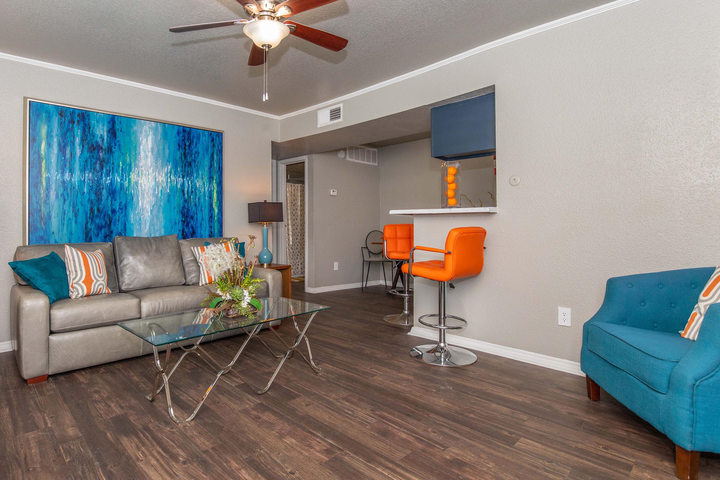 a living room filled with furniture and a tv