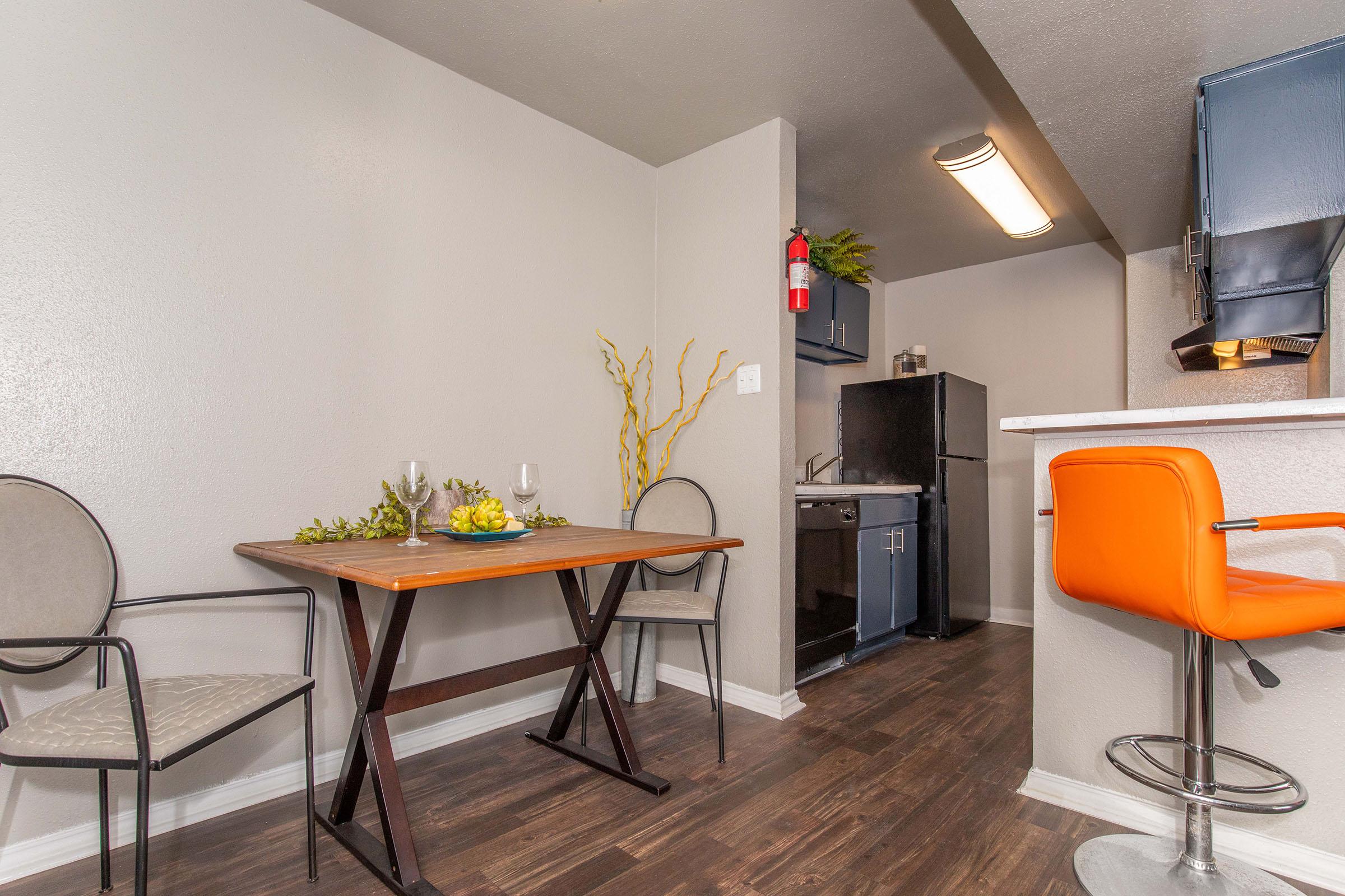 a kitchen with a table in a room