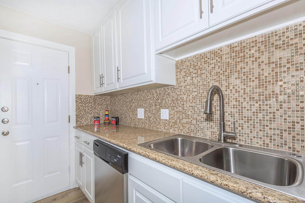 a kitchen with a stove and a sink