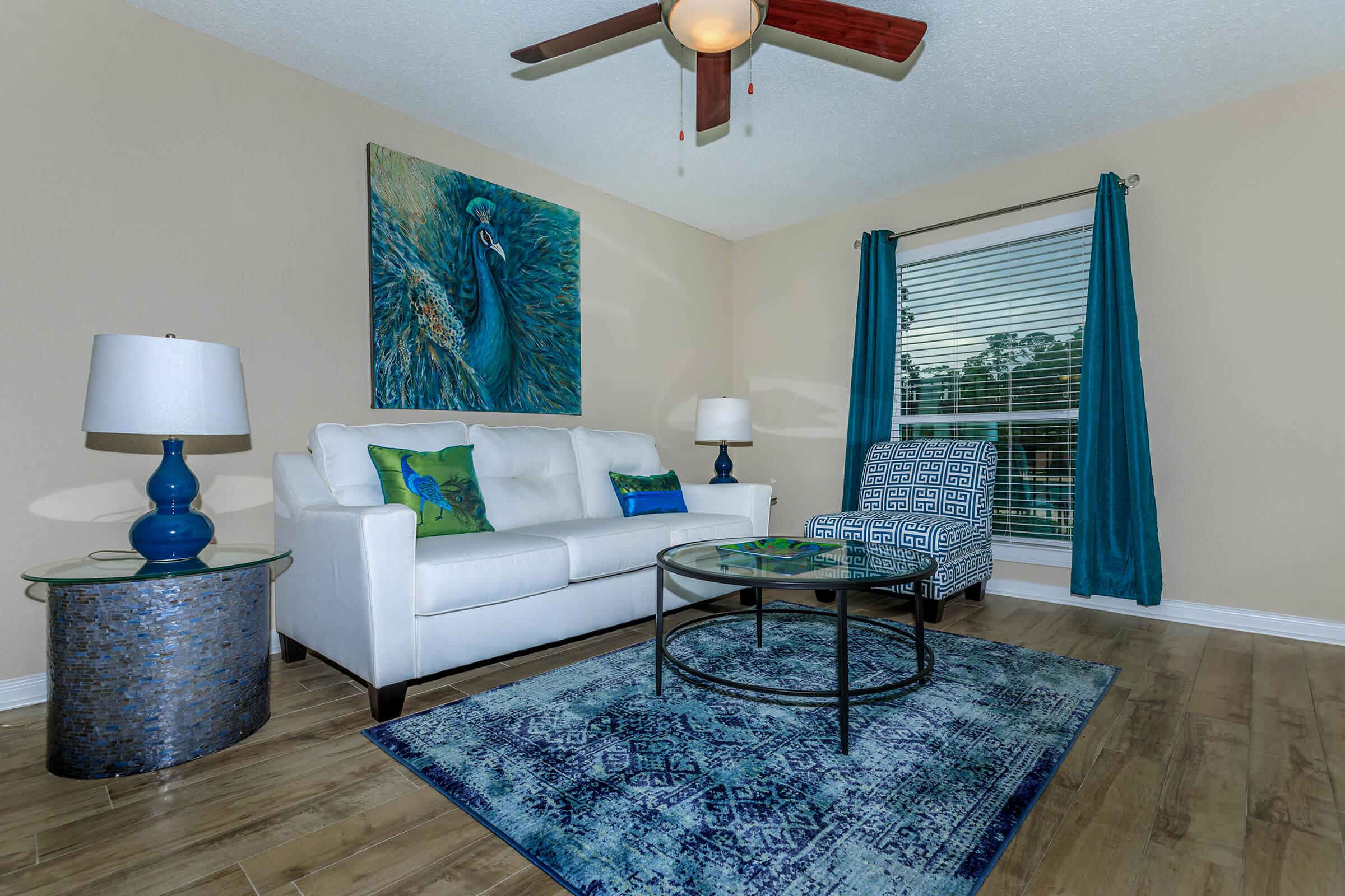 YOUR NEW LIVING ROOM AT MONTABELLA AT OAK FOREST APARTMENTS