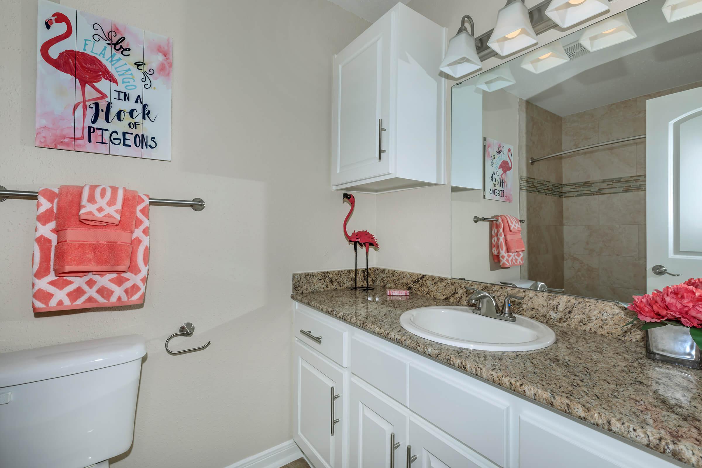 a kitchen with a sink and a mirror