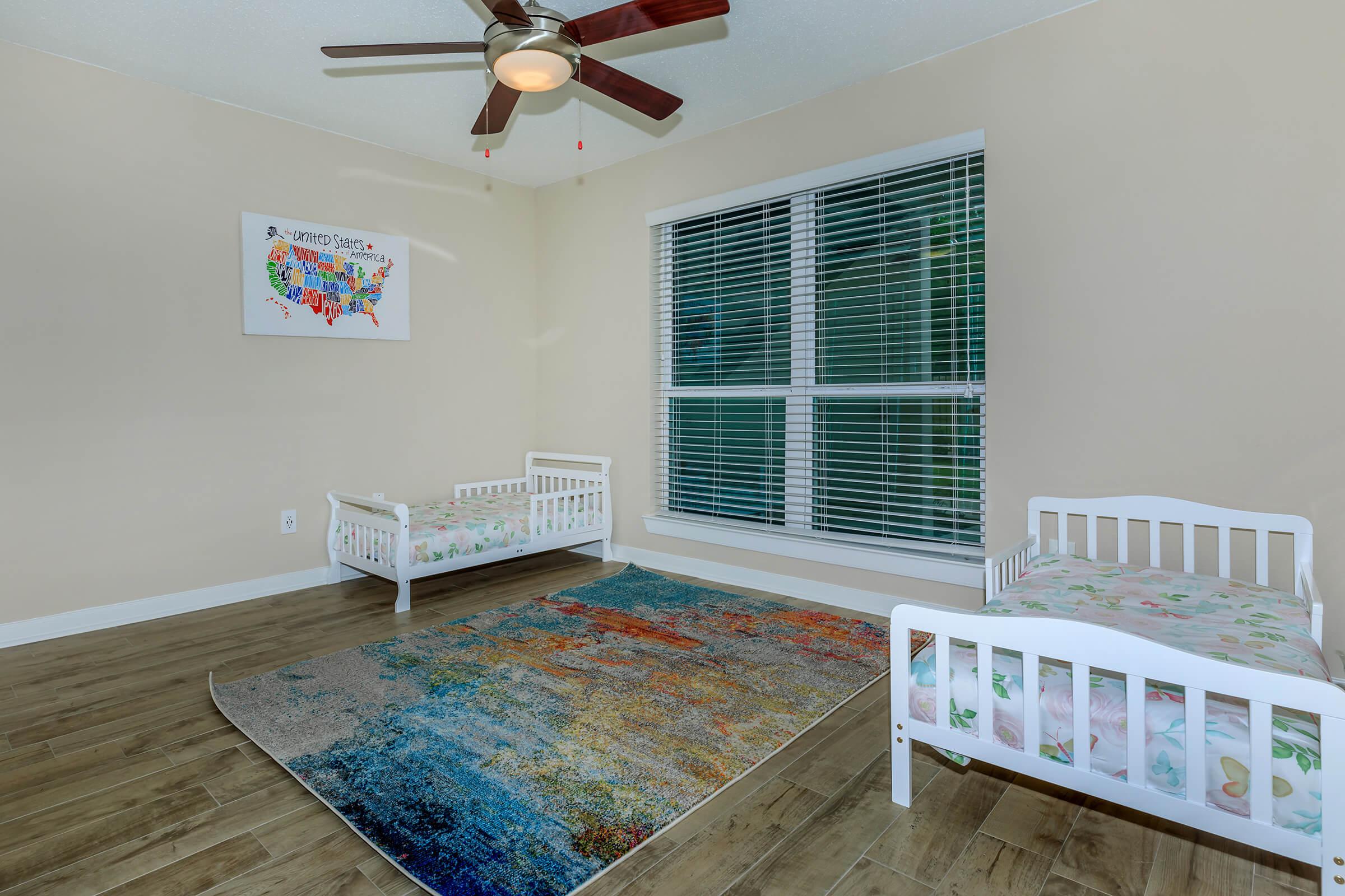 a bedroom with a large window